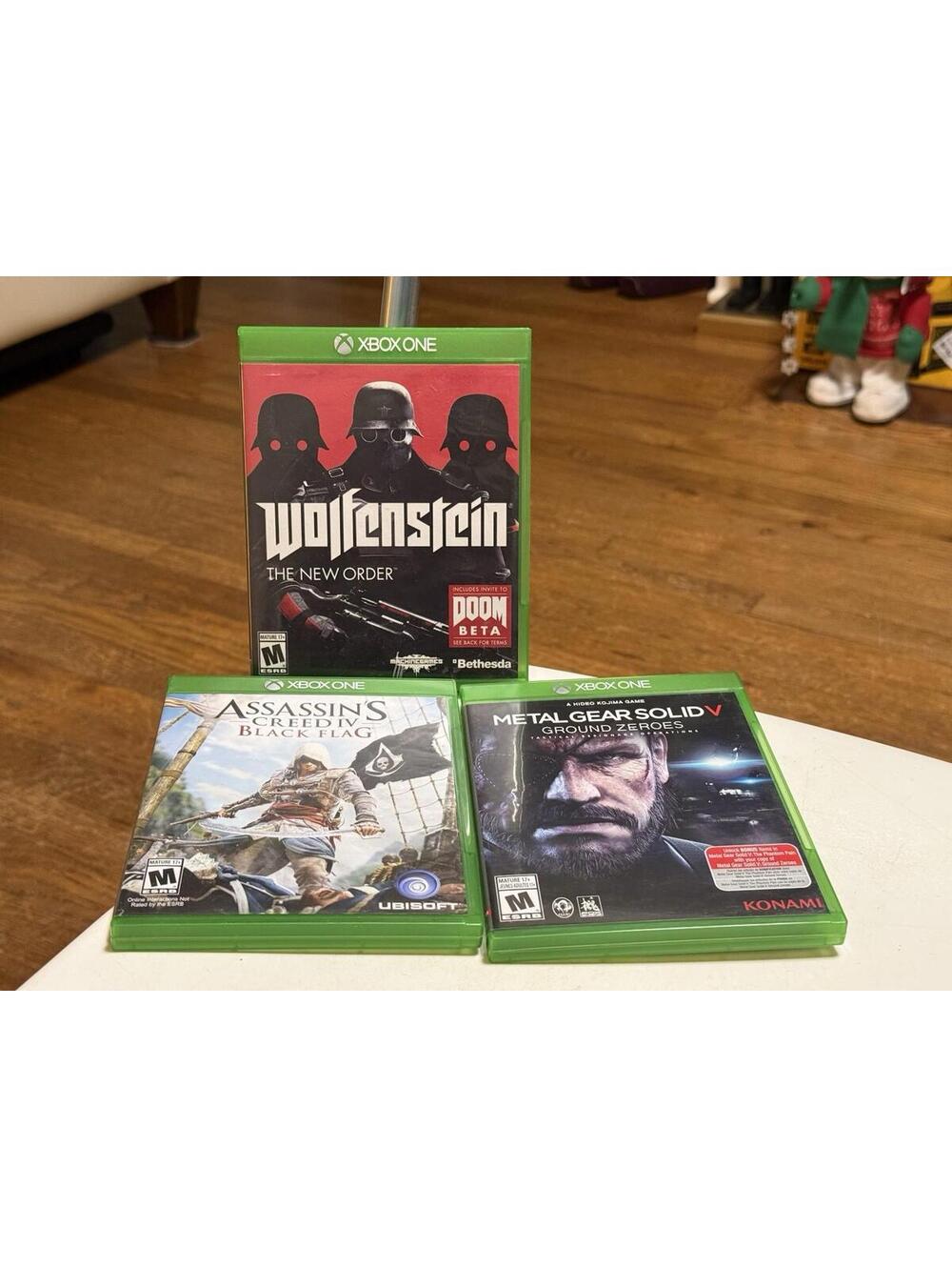Xbox One Games Lot Of 3, Wolfenstein, Assassin’s Creed, Metal Gear Solid V